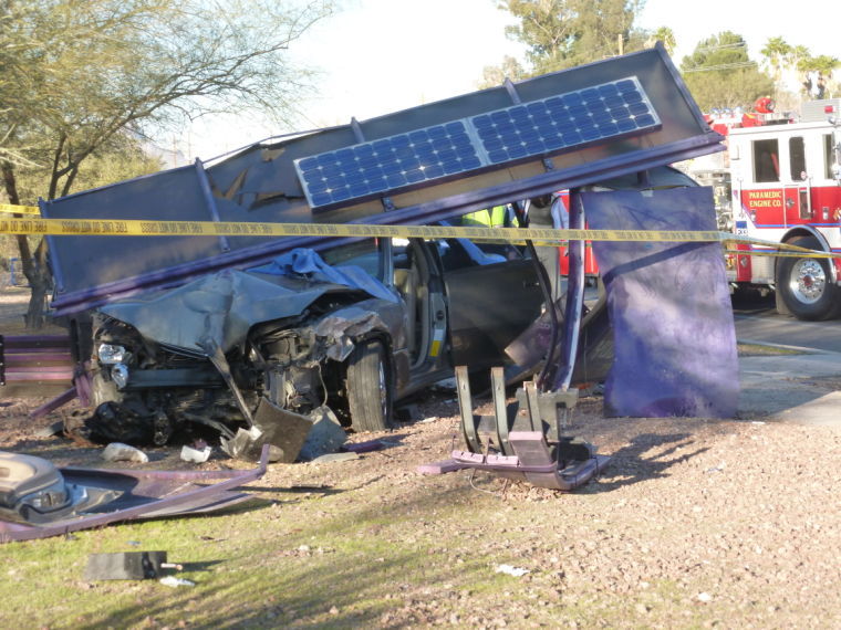 Car collides into bus stop
